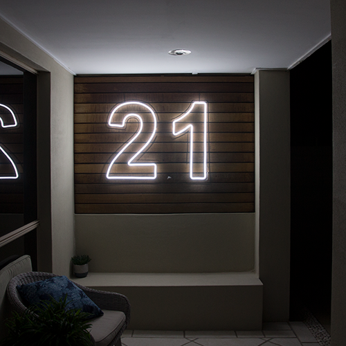 21 Neon sign hire in white Outside