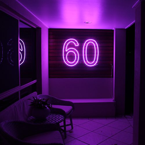 60 Neon sign mounted